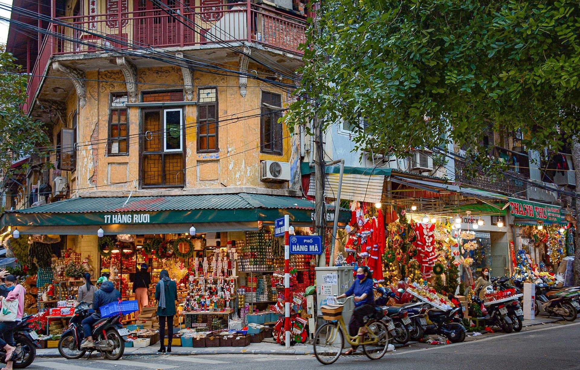 Bustling street life in Ha Noi Viet Nam Old Quarter with local shops