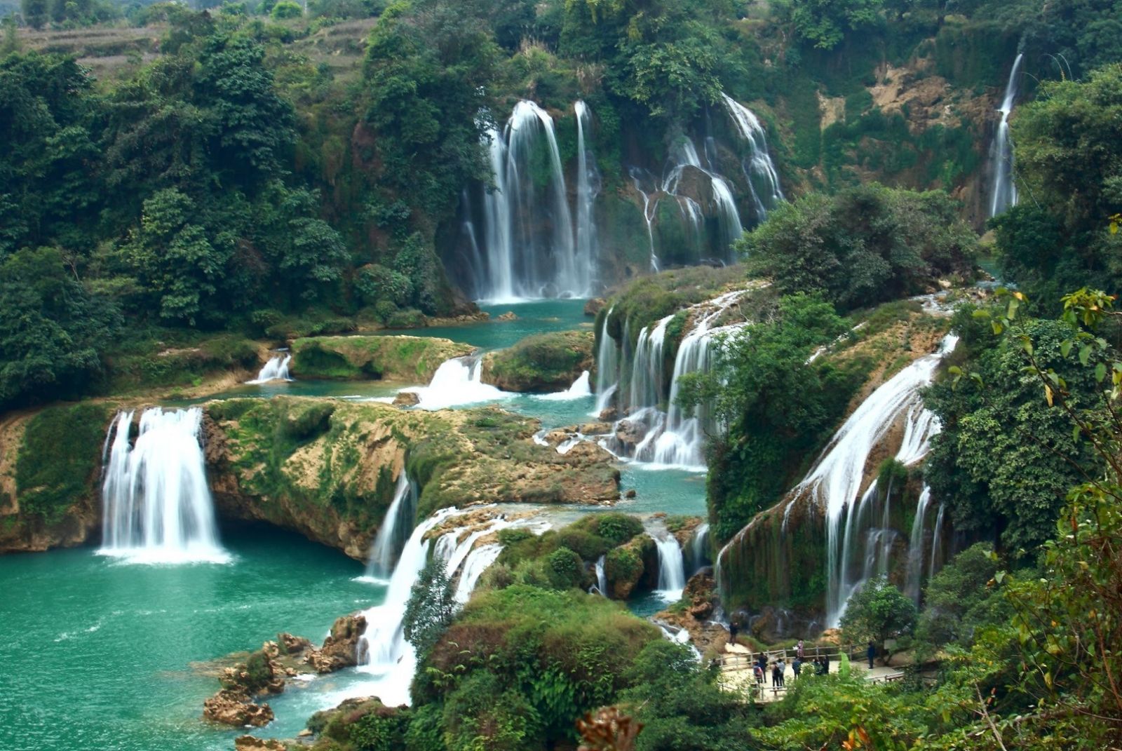 Silver Waterfall cascading through the mountains, refreshing natural places to see in Sapa