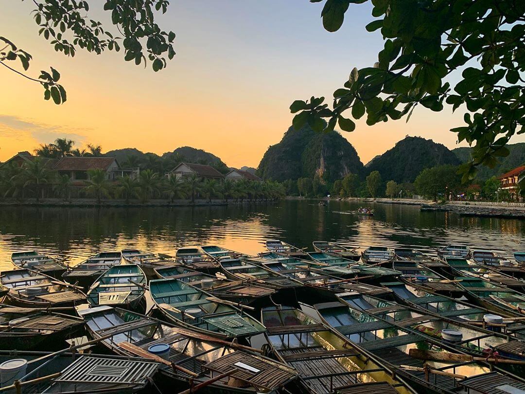 Bamboo boat ride through limestone karsts in Tam Coc