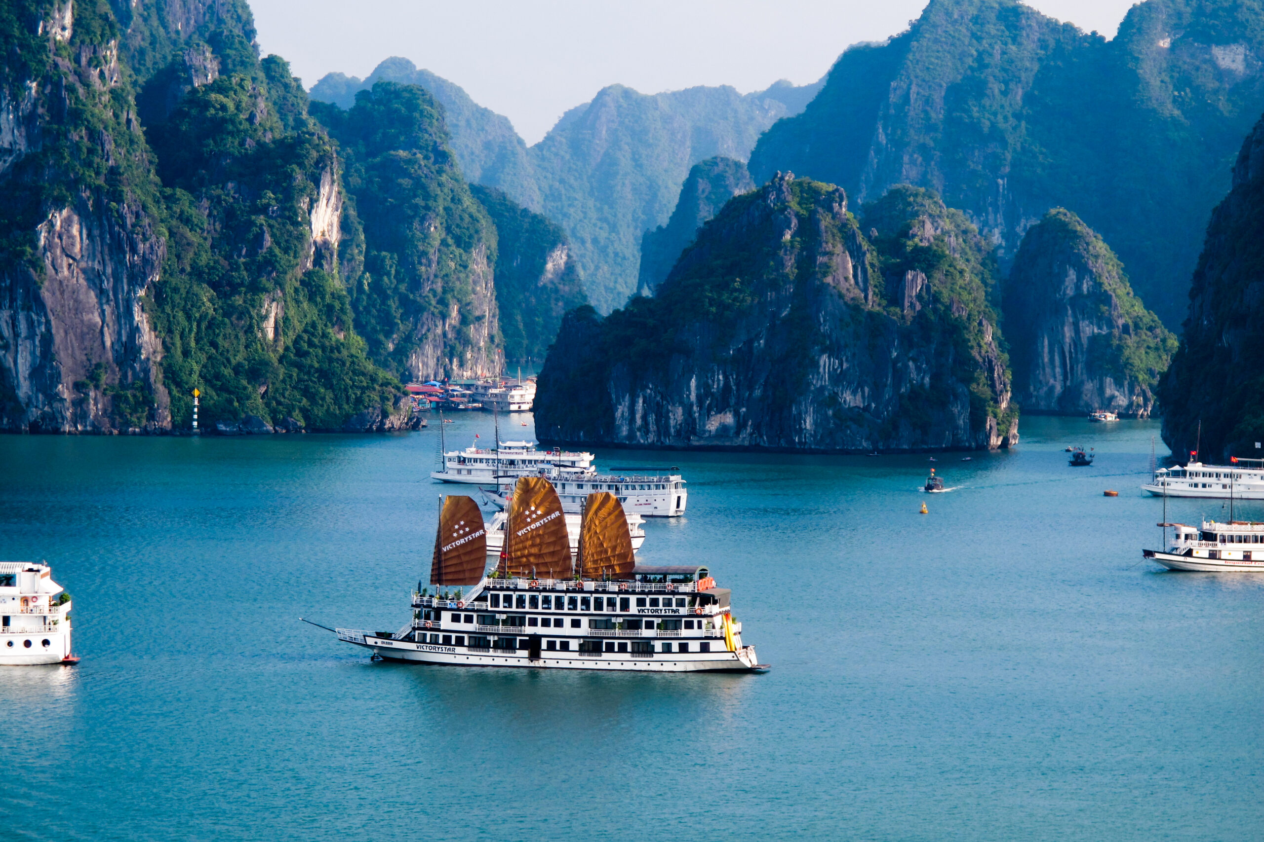Cruising through Ha Long Bay limestone karsts