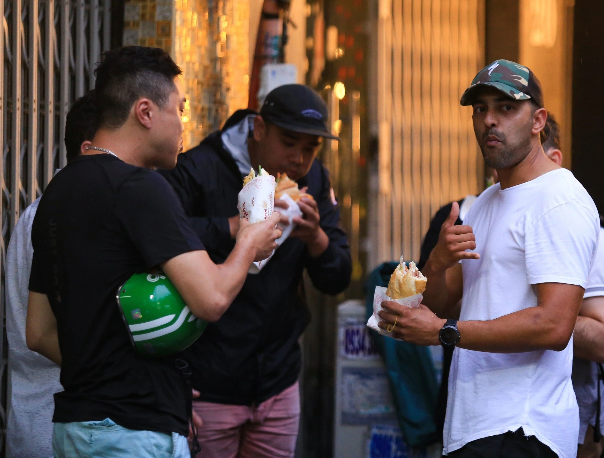 Travelers enjoying Vietnam street food safely on a busy street