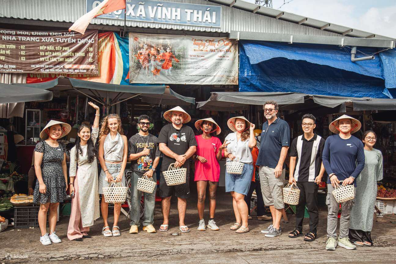 Travelers interacting with locals while exploring everyday life in Vietnam