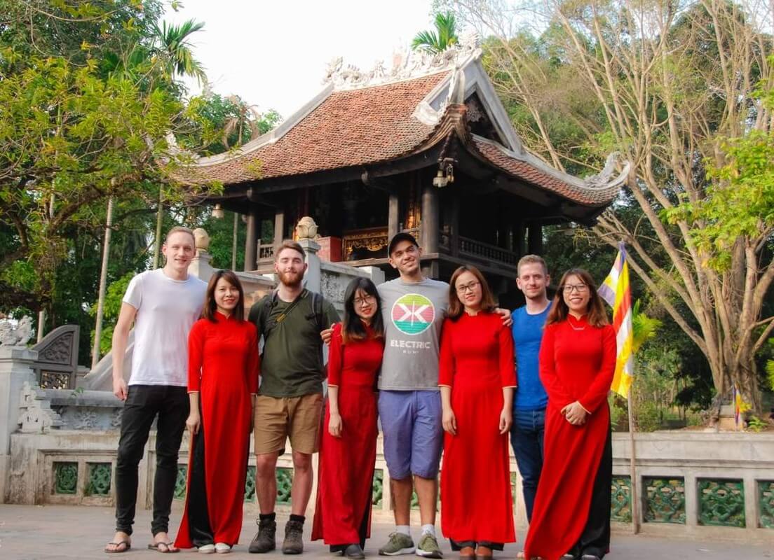 Visitors covering up with scarves before entering a Vietnamese temple
