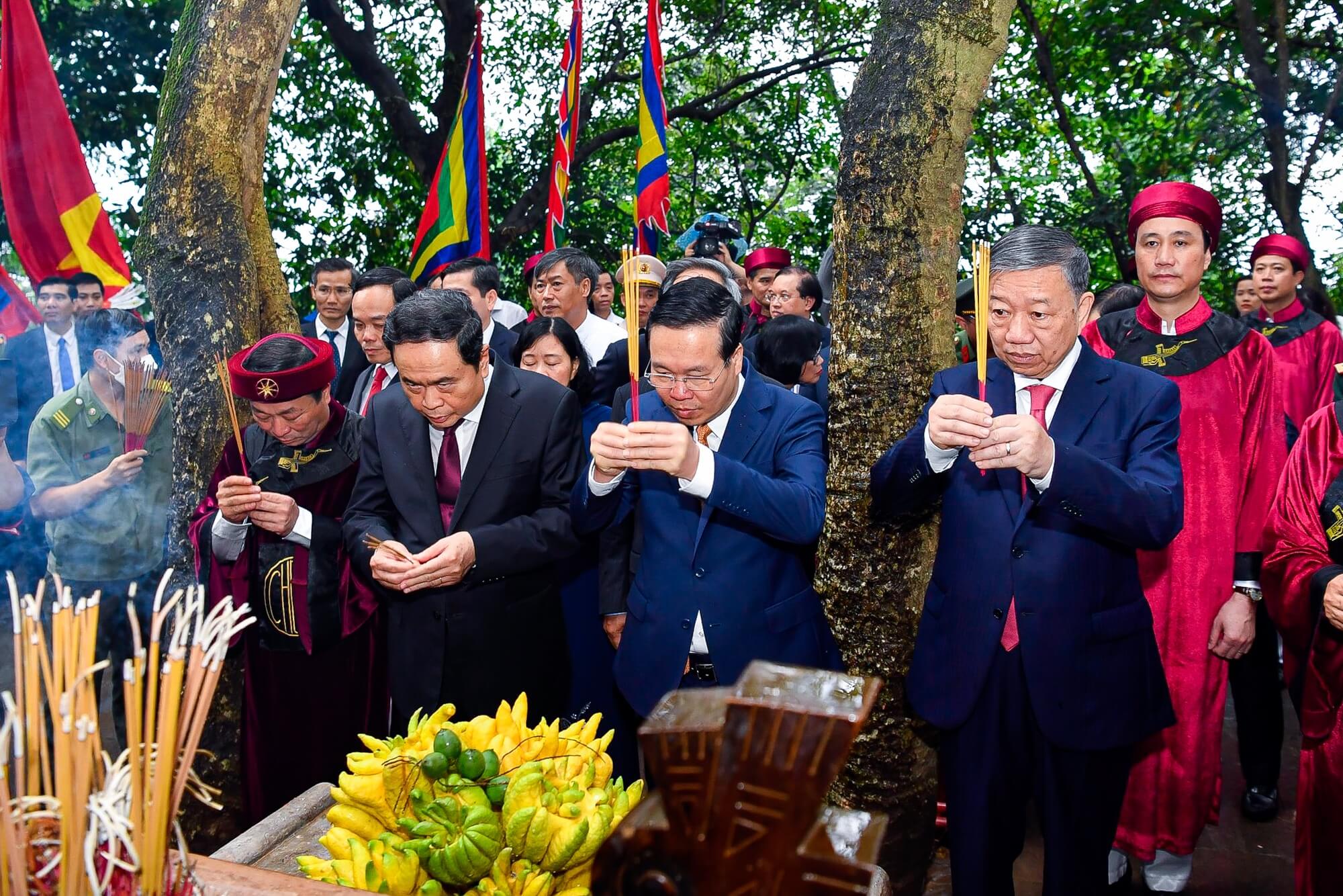 Worshippers praying inside a Vietnamese temple with traditional religious atmosphere