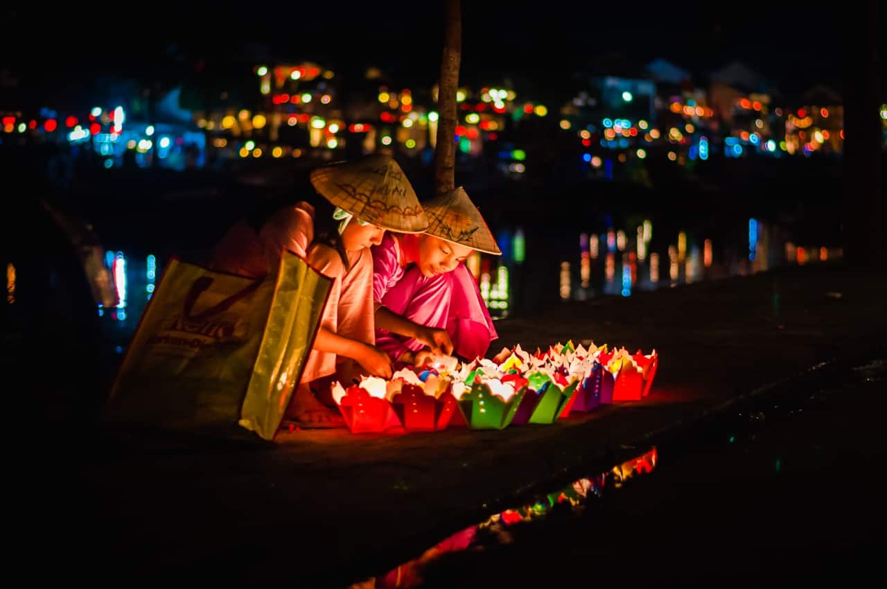 Glowing lanterns illuminating the ancient town at night