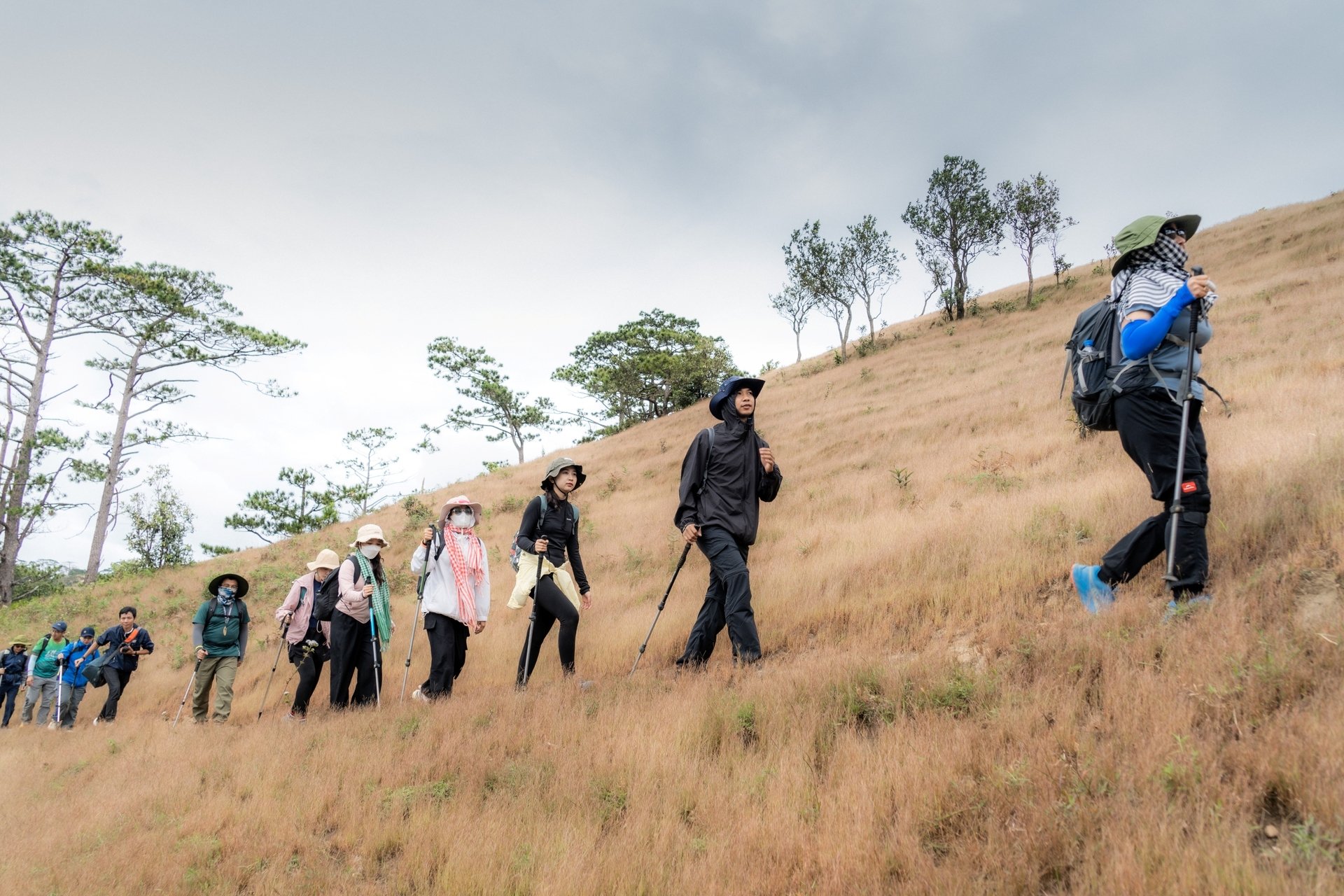 Local guide assisting hikers on a remote mountain trail
