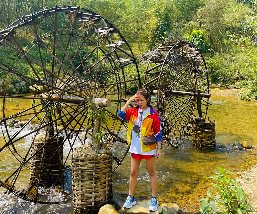 Lush rice terraces and traditional water wheels on Pu Luong hiking trails