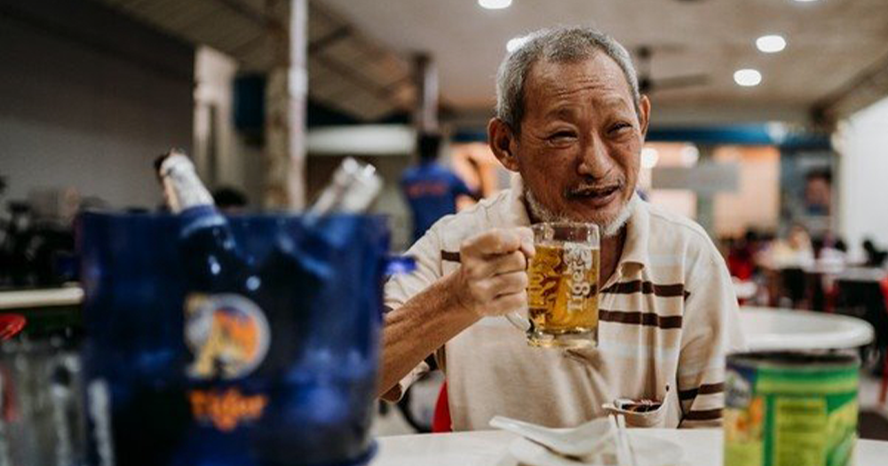 Elder leading the first toast at a family dinner
