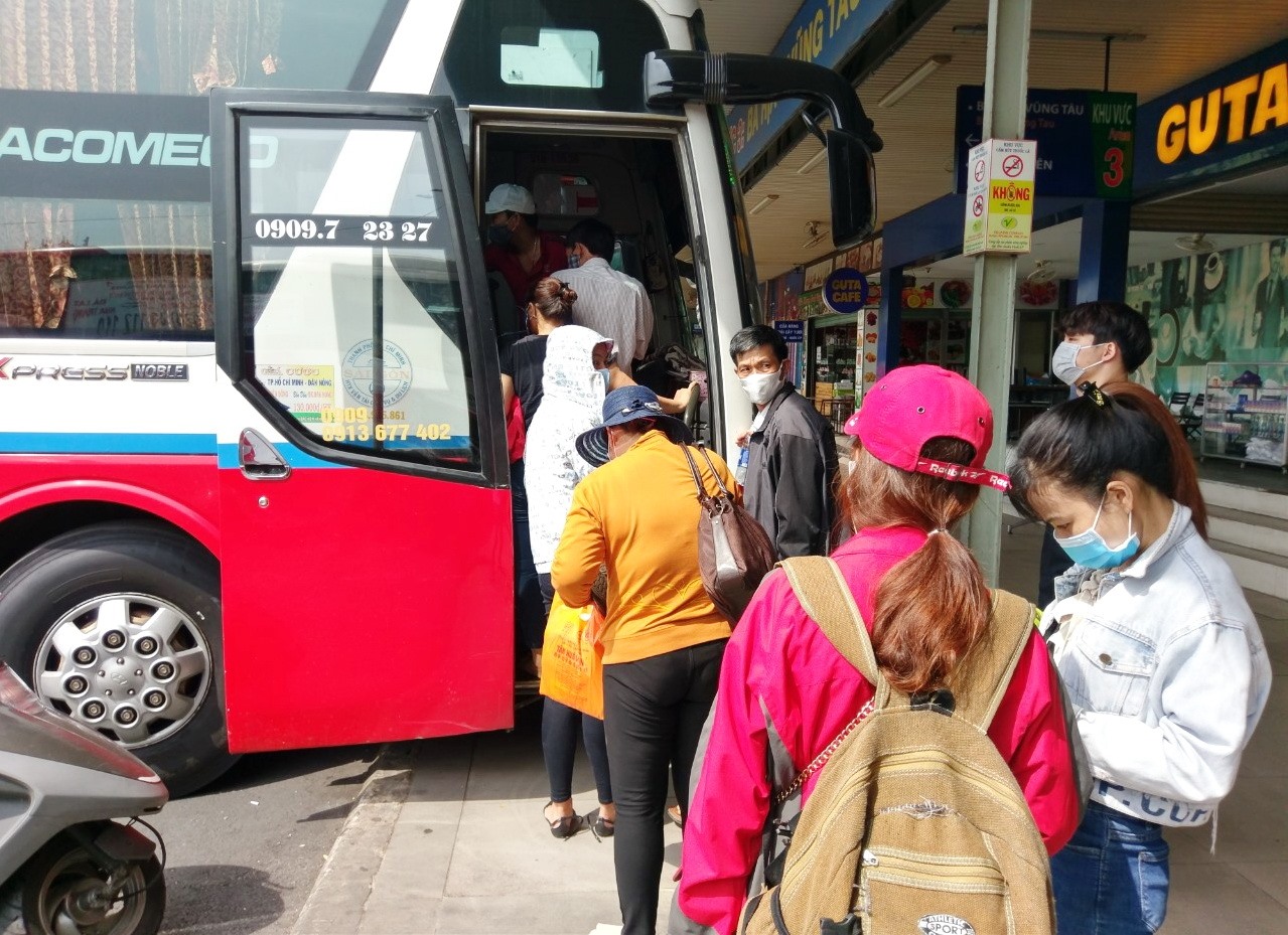 Passengers boarding an intercity bus in Vietnam