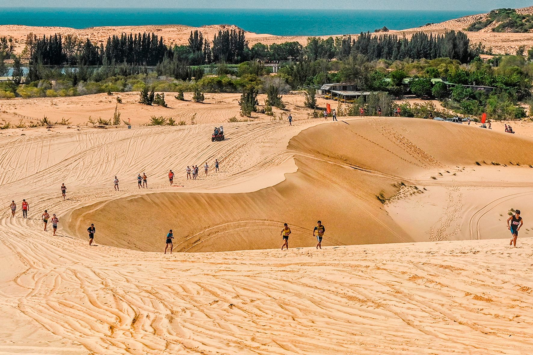Sandboarding on the white sand dunes in Mui Ne