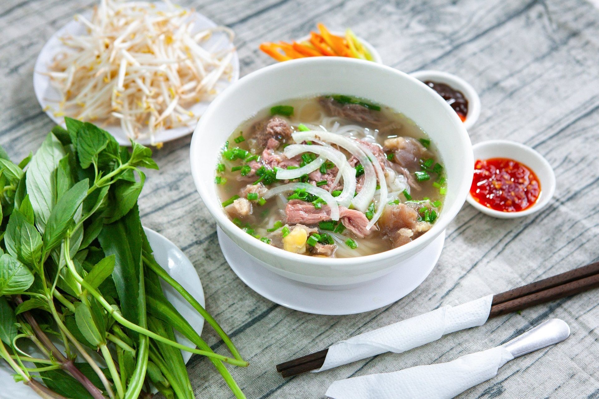Traditional beef pho with fresh herbs