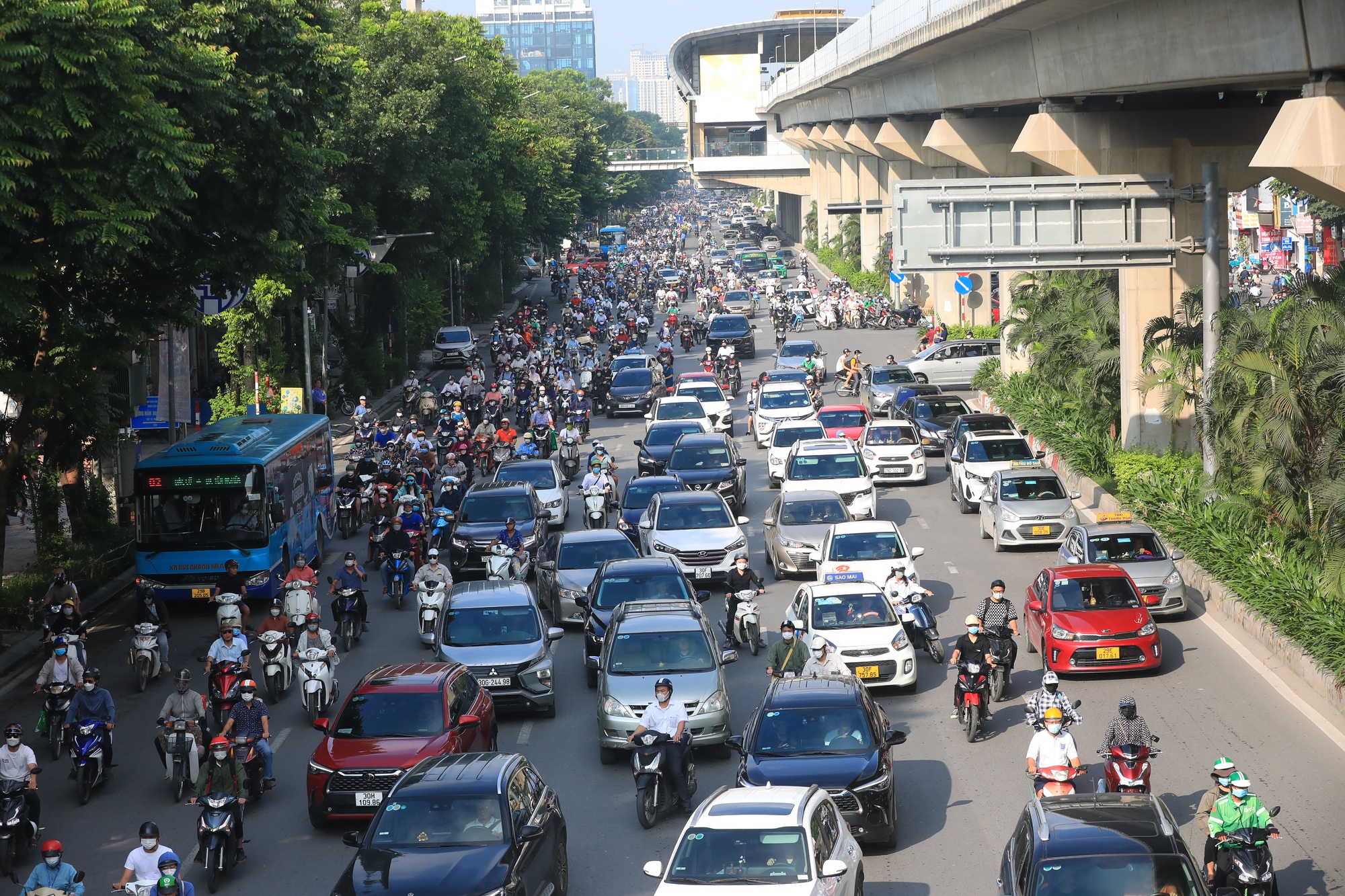 Urban traffic scene showing different types of public transport in Vietnam