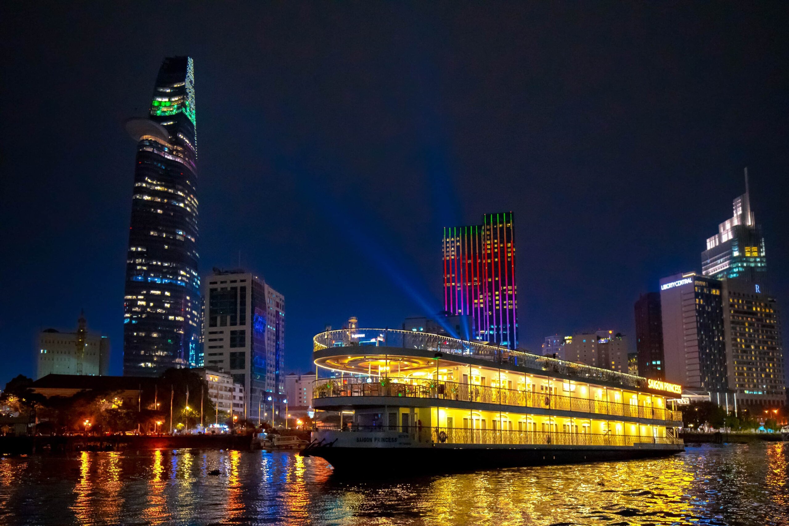 Evening river cruise along the Saigon River with city skyline