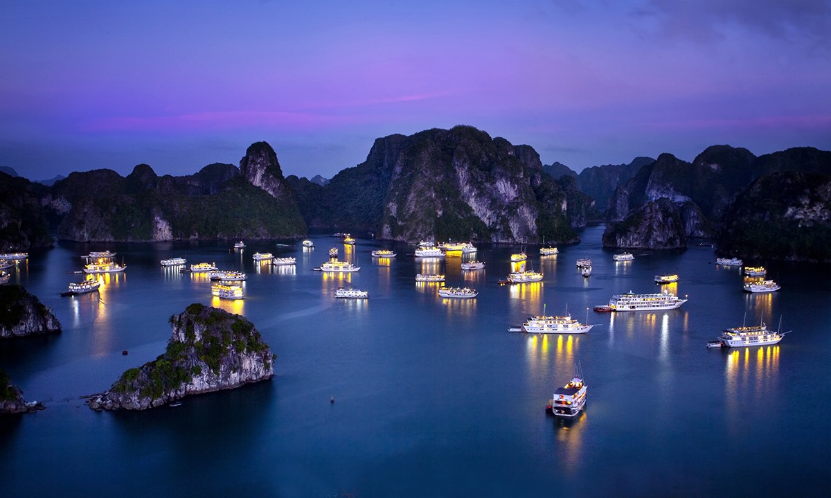 Ha Long Bay aerial view with luxury cruise boats among limestone islands