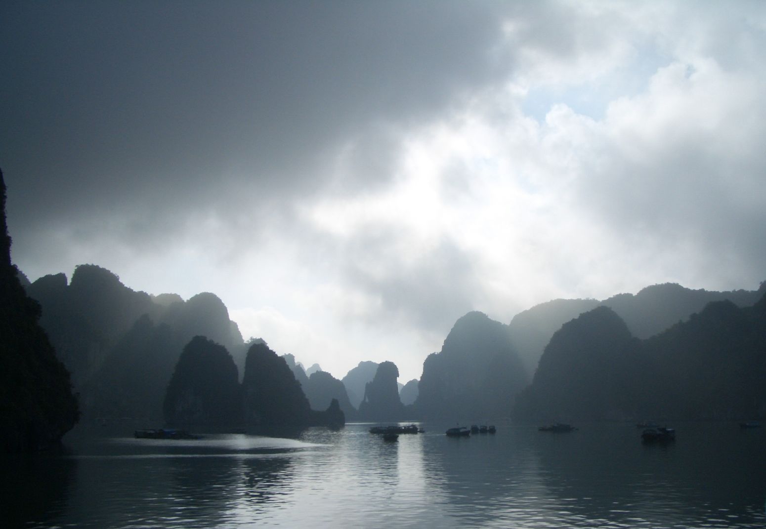 Misty limestone islands creating a mysterious winter landscape in Ha Long Bay