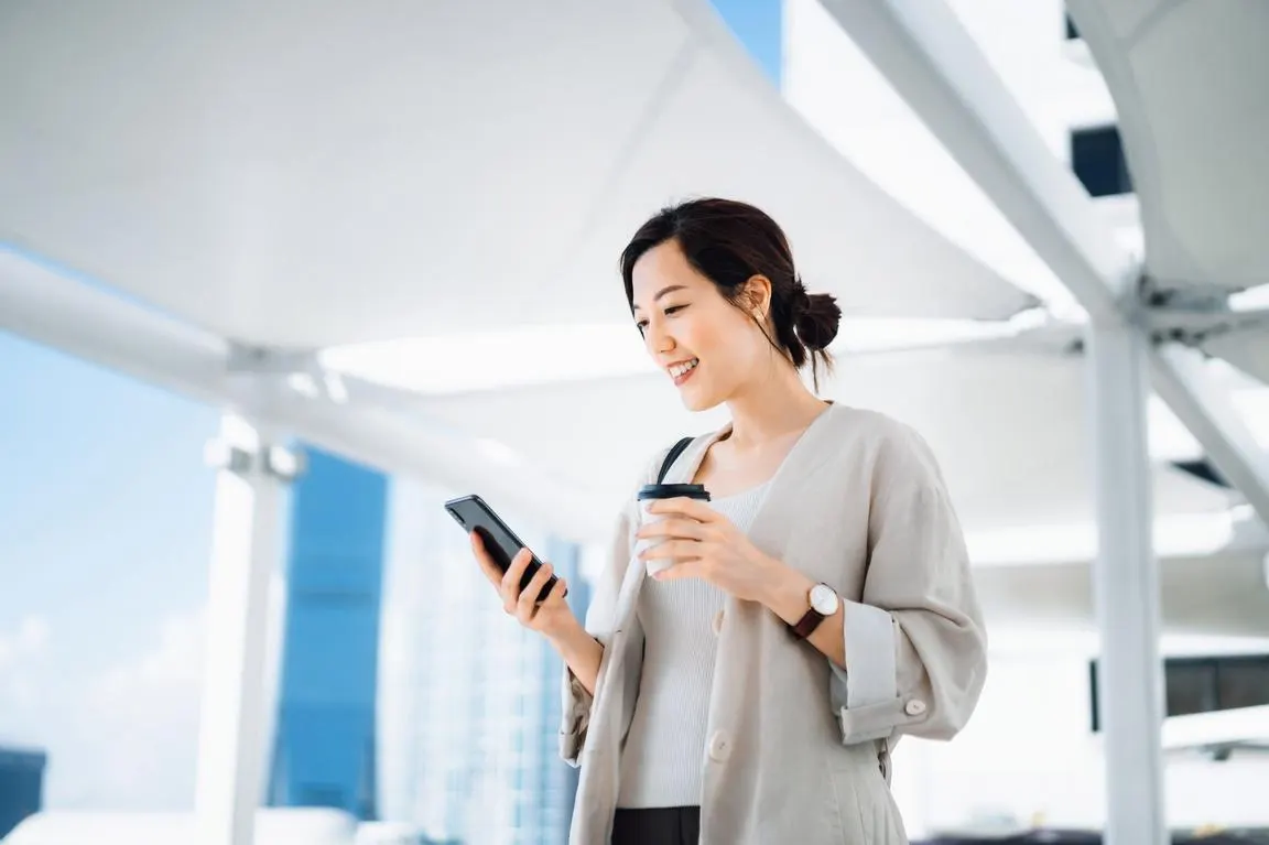 Traveler reviewing a travel itinerary while planning a trip