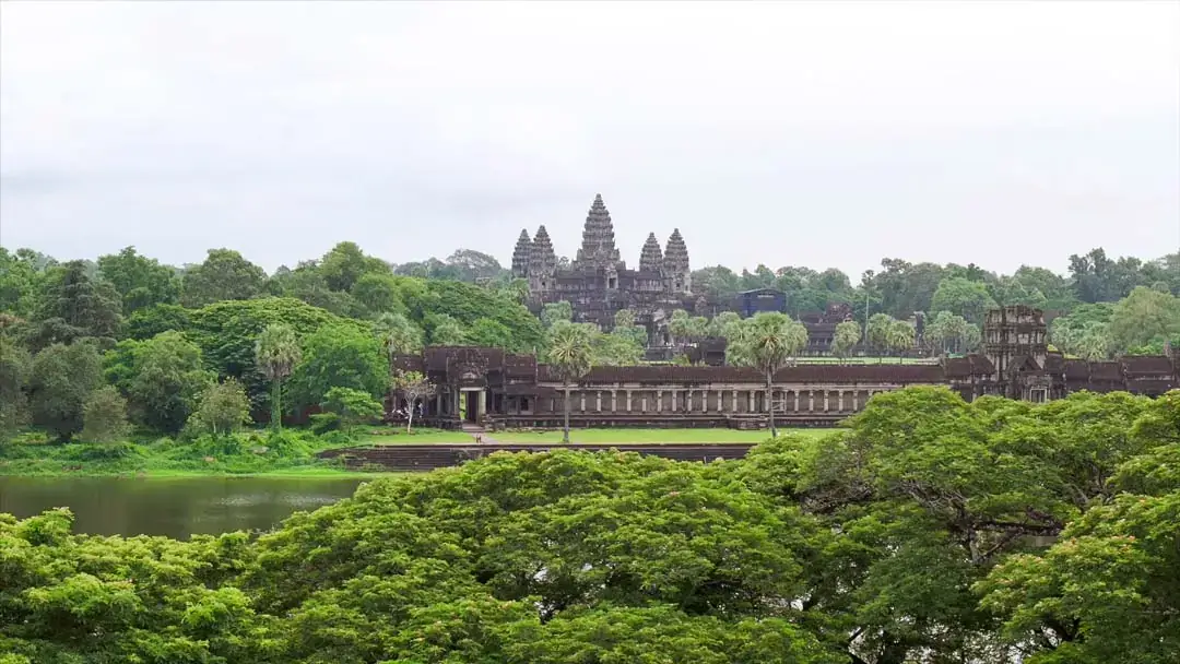Lush green landscape surrounding Angkor temples in rainy season