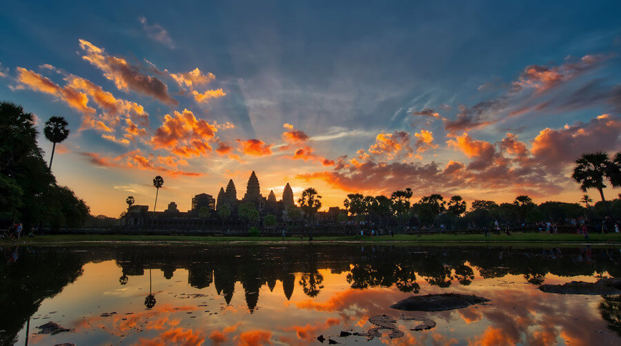 Sunrise view of Angkor Wat temple reflected in the lotus pond