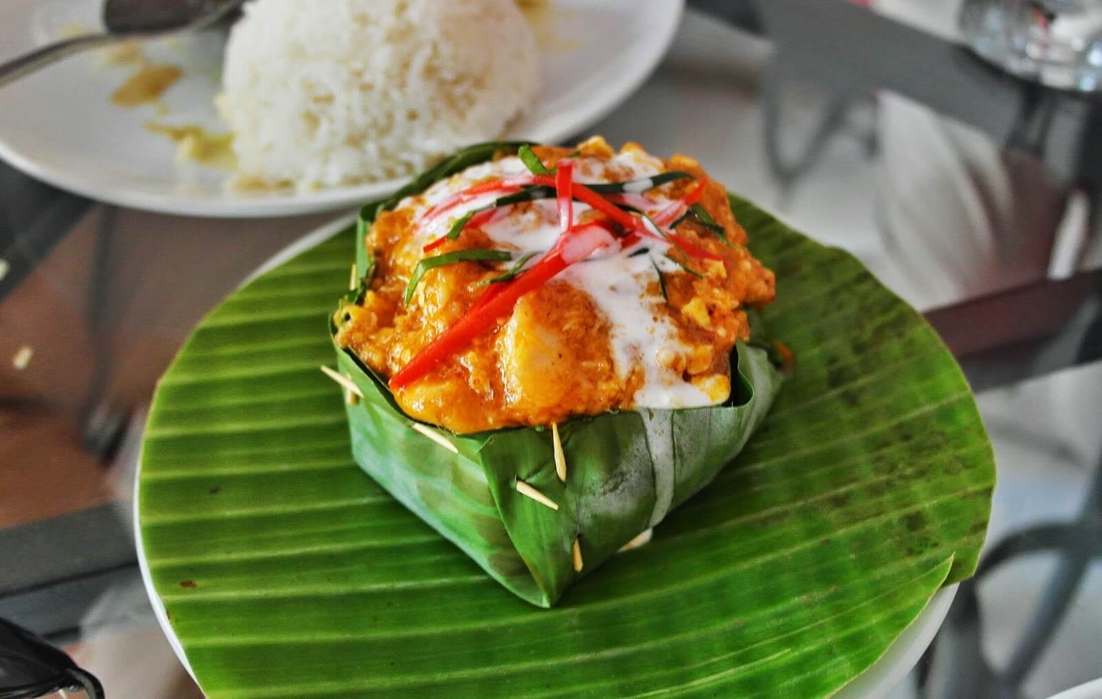 Traditional Cambodian fish amok served in banana leaf bowl
