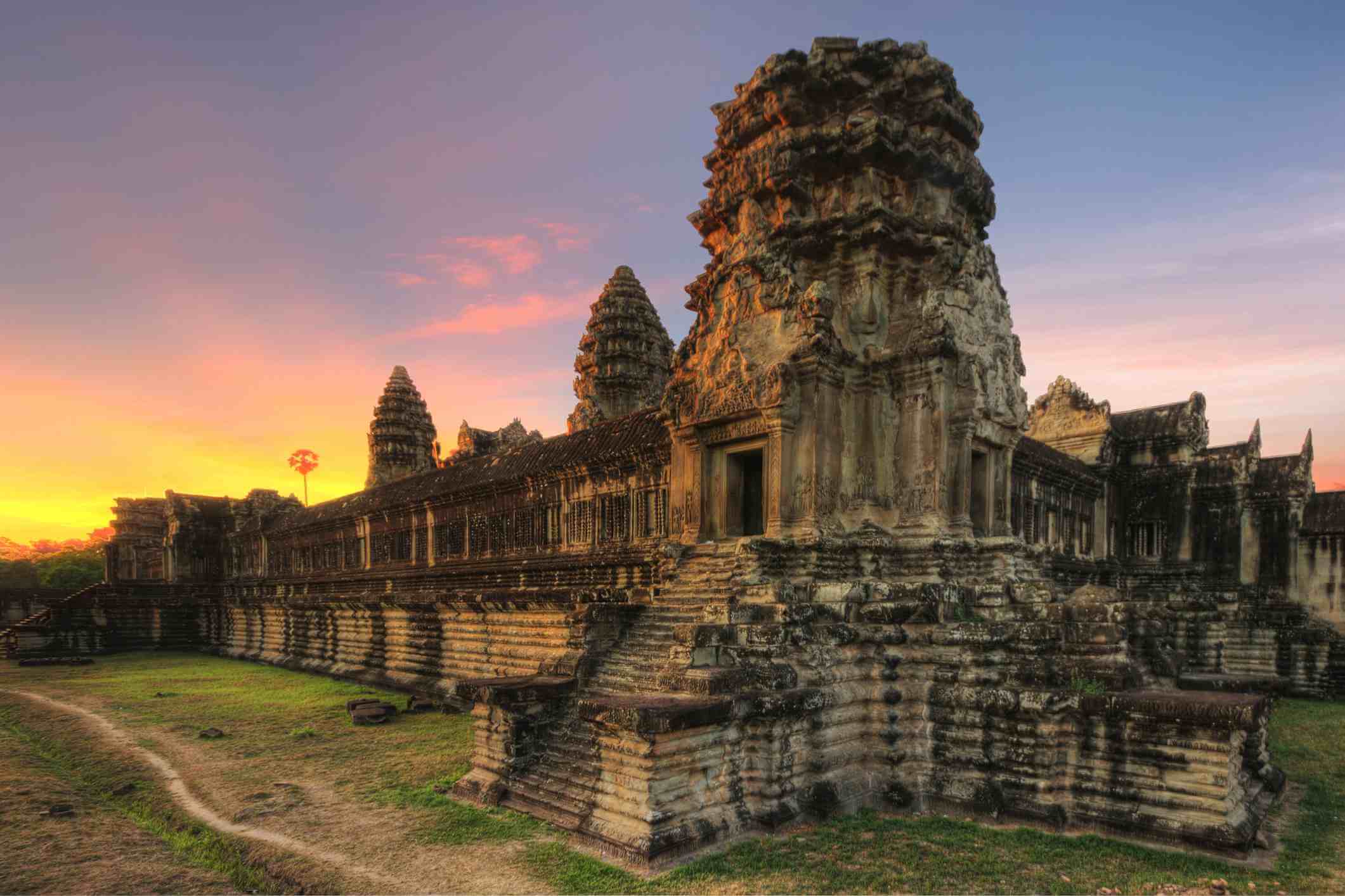 Traveler admiring sunset views over iconic Southeast Asian landscapes