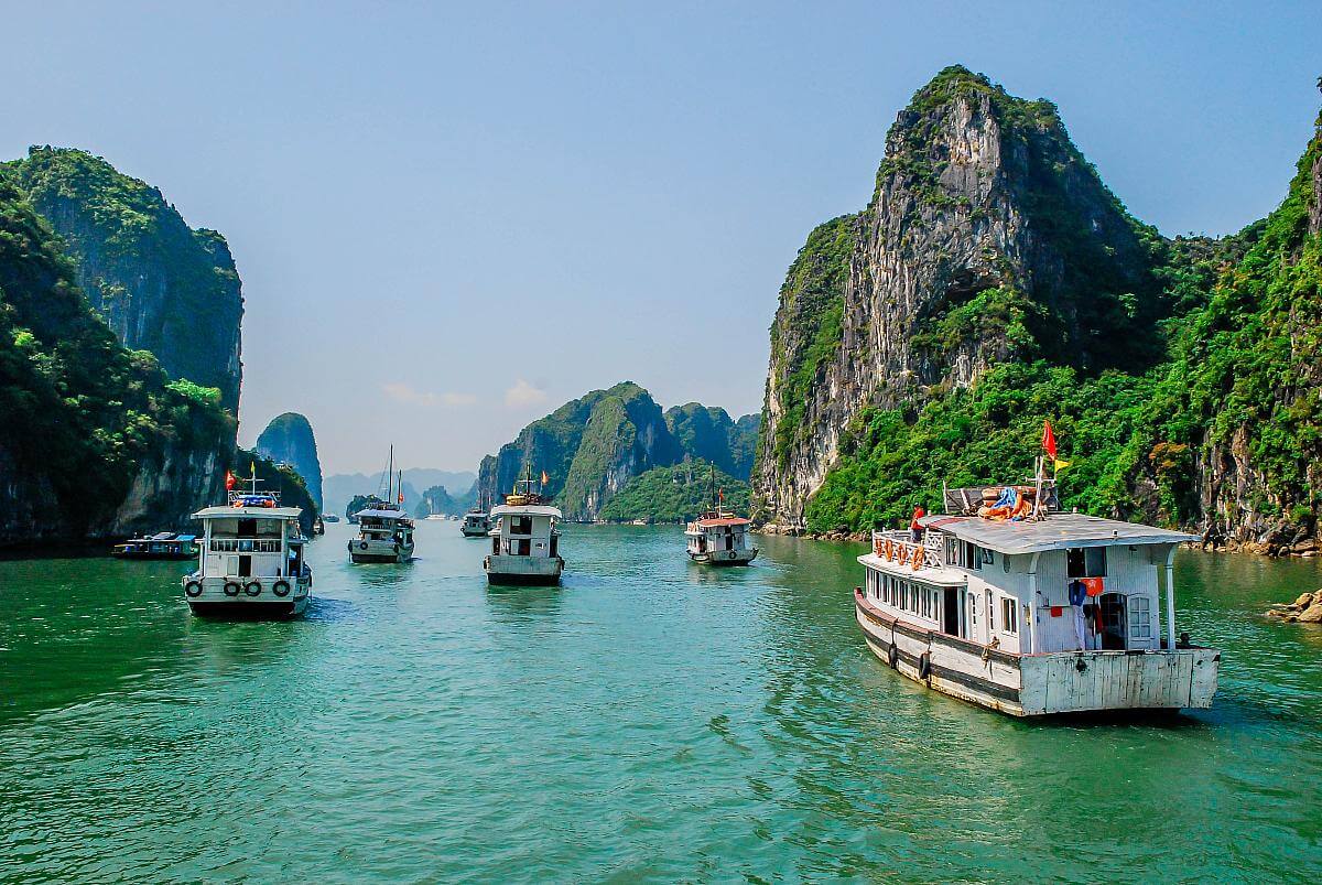 Travelers visiting cultural landmarks across Vietnam and Cambodia on a short itinerary