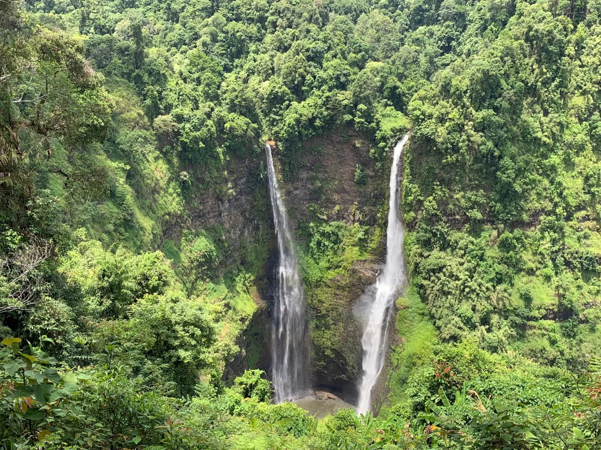 Waterfall in southern Laos surrounded by lush jungle